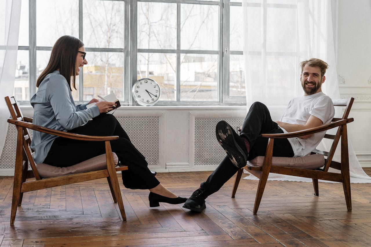 Crafting Captivating Headlines: Your awesome post title goes here Counselor and client in a positive therapy session in a well-lit room.
