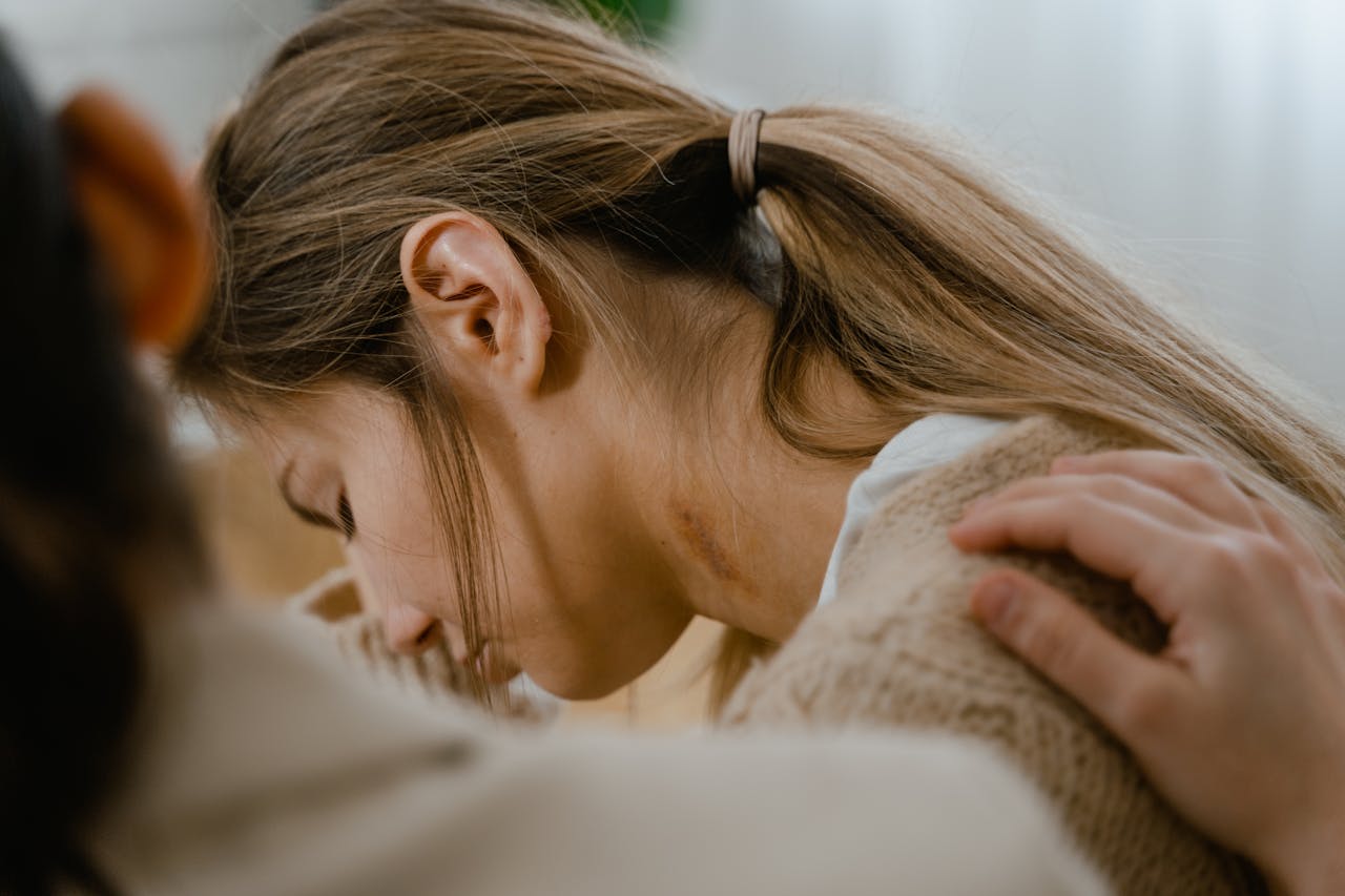 Mastering the First Impression: Your intriguing post title goes here An emotional moment showing a comforting gesture with a hand on a woman's shoulder.